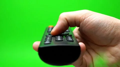 Hand Pressing TV Remote Control Buttons on Green Screen Video stock 331309020