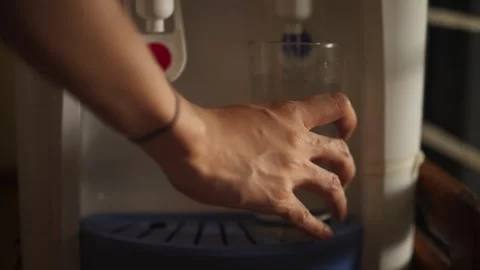 Hand Pressing Water Dispenser Button Stock Footage 344235957