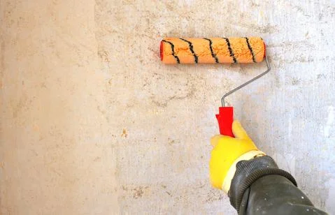 Hand primer with roller with copy space Stock Photos
