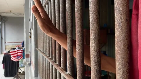 A hand of prisoner in cell of prison Stock Footage 277683778
