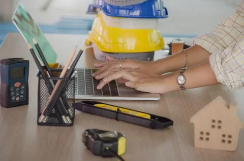 Hand professional architect, engineer or interior hands working with laptop a Stock Photos