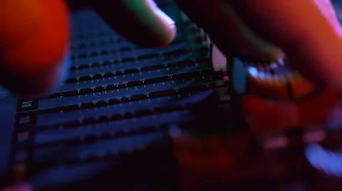 Hand on professional audio mixing console with faders and adjusting knobs Stock Footage 47923051