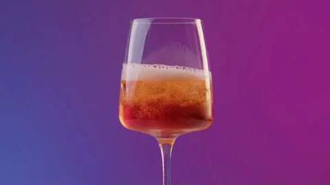 Hand of a professional bartender pours prosecco from bottle into long drink Stock Footage 246477171