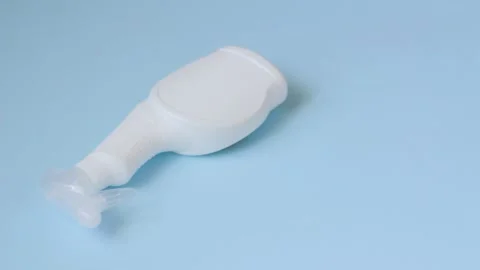 Hand in protective glove is putting a sponge and a brush on a blue surface. Stock Footage 132696102