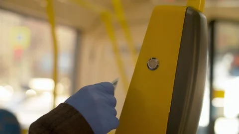 Hand in protective gloves paying in the bus Stock Footage 127297875