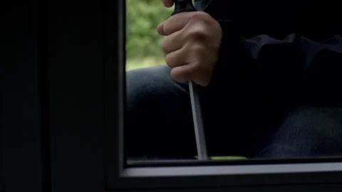 Hand Prying Open a Window with Crowbar, Daytime Break In, Close Up Shot Stock Footage 341527351