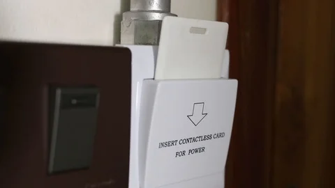 Hand pull the card key out of gain power hotel switches slot Stock Footage 108447780