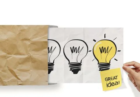 Hand pull crumpled paper show light bulb out of recycle envelope as concept Stock Illustration