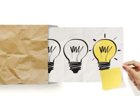 Hand pull crumpled paper show light bulb out of recycle envelope as concept Stock Illustration