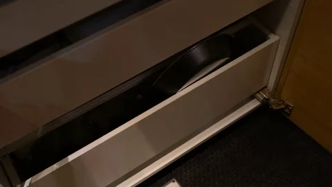 The hand pull out drawer to keep the pot and pan Stock Footage 79430465