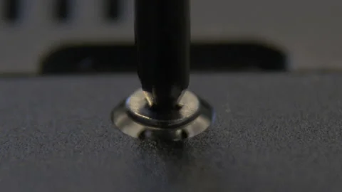 A hand-pulled craftsman tightens a screw with a screwdriver. Stock Footage 170794654