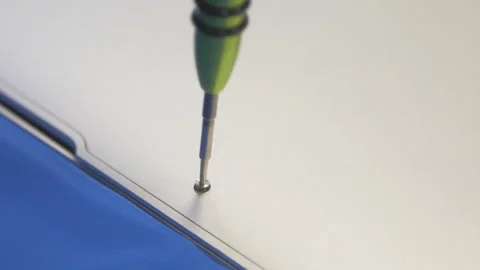 A hand-pulled craftsman tightens a screw with a screwdriver. Stock Footage 170795200