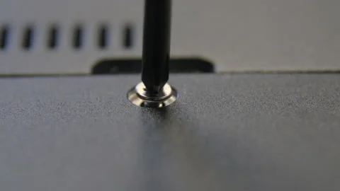 A hand-pulled craftsman tightens a screw with a screwdriver. Stock Footage 170798234