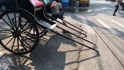 Hand Pulled Rickshaw and street view at the city Kolkata Stock Footage 98768180
