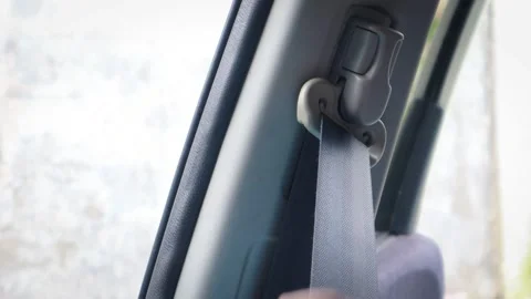 Hand pulling car seat belt Stock-Footage 334699347