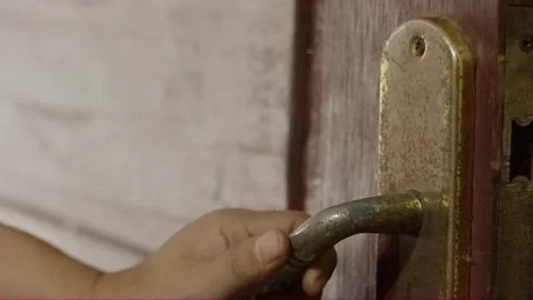 Hand pulling dirty old metal door handle close-up Stock Footage 320130648