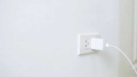 Hand pulling electrical cord plug from outlet. Stock Footage 161930413