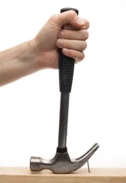 Hand pulling out a nail with hammer Stock Photos