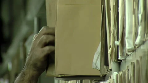 Hand Pulling Paper File From Archive Shelf, Manual Document Storage System Stock Footage 252865340