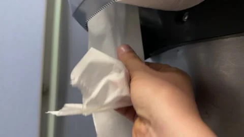 Hand pulling paper towel close up Stock Footage 332353162