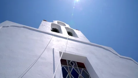 Hand pulling the rope of the Catholic bell tower to ring the bell Stock Footage 102274270