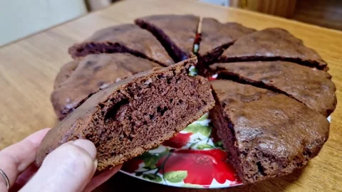 Hand Pulling a Slice of Chocolate Cake Stock Footage 325222594