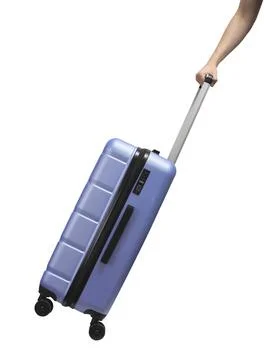 Hand pulling suitcase. Side view of large hardshell luggage with lock, zipper Stock Photos