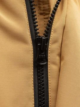 Hand pulling tan jacket zipper cord Stock Photos