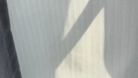 Hand Pulling Off-white Curtain in Sunlight Texture Fabric Close-up Vídeos de archivo 332318327