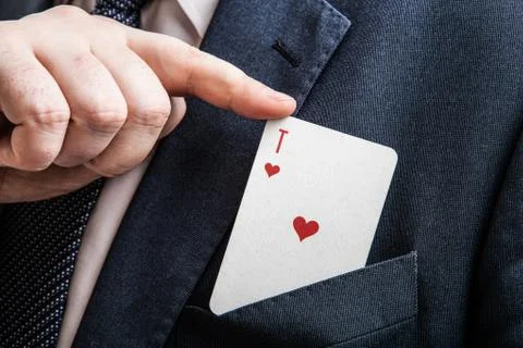 Hand pulls the card ace of hearts Stock Photos