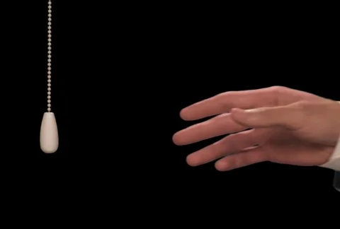 Hand pulls light cord down Stock Footage 754633