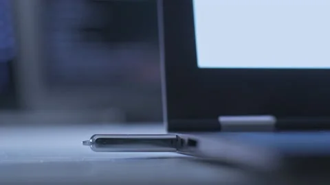 Hand pulls out USB flash drive from a laptop computer Stock Footage 143009841