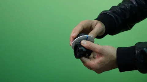 Hand Pulls A Professional Follow Focus on green screen Stock Footage 97292471