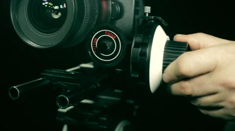 Hand pulls a professional follow focuss. DSLR Stock Footage 47069738