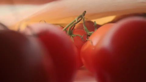 A hand pulls red tomatoes out of a paper bag, close up. Fresh juicy healthy Stock Footage 147934575
