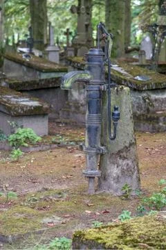Hand pump in a graveyard Stock Photos