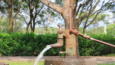 A hand pump with over 100 years of history.Groundwater extraction tool. Stock Footage 278282423
