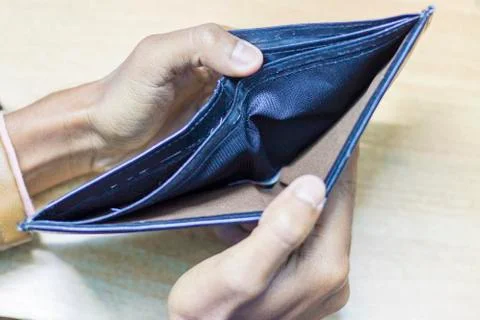 Hand with purse Stock Photos