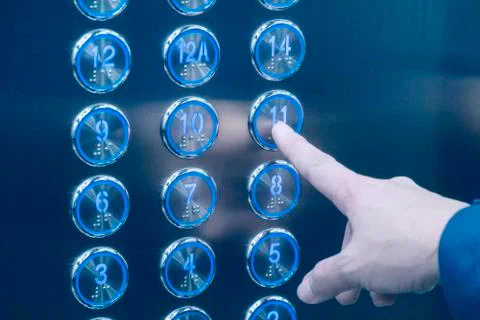 Hand push the elevator button 11th floor Stock Photos