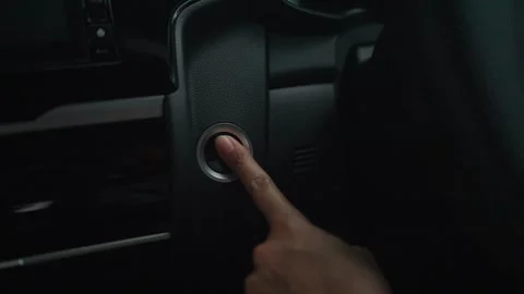 Hand push to start car engine Follow to button Finger presses the button  Stock Footage 264105427