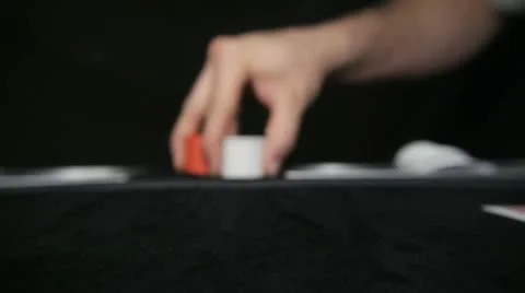 Hand pushes poker chips toward camera Stock Footage 11093103