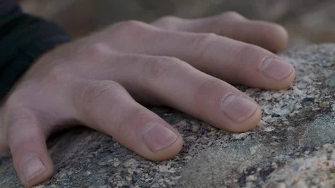 Hand pushes off of rock while climbing in slow motion Stock Footage 90818325