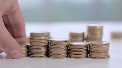 A hand pushes some coins on the table 스톡 동영상 58509465