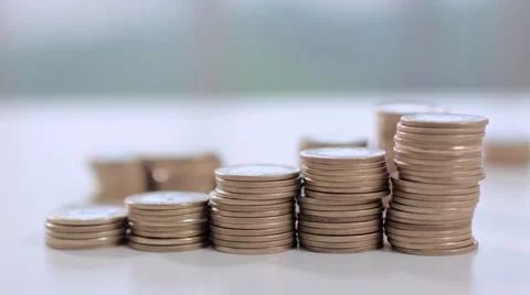 A hand pushes some coins on the table Stock Footage 58509470
