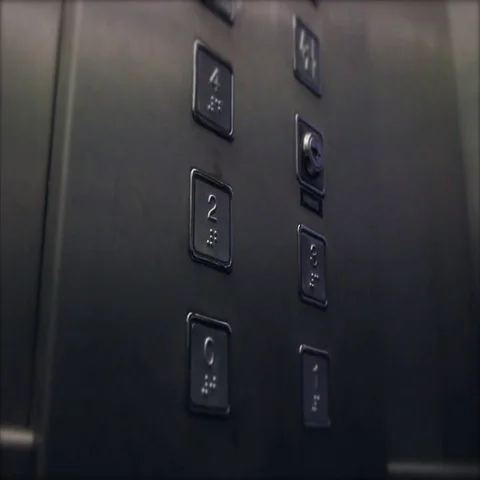 Hand pushing the 3rd floor button on the elevator Видео 69647030