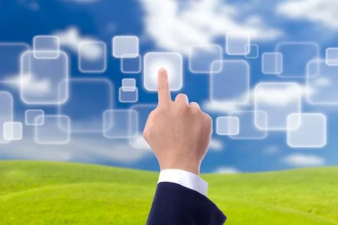 Hand pushing button on blue sky Stock Photos