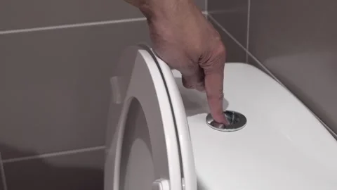 Hand pushing a button to flush 動画素材 333302410