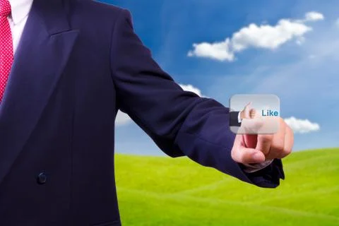 Hand pushing like button Stock Photos
