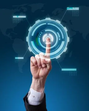Hand pushing a button on a touch screen futuristic interface Stock Photos