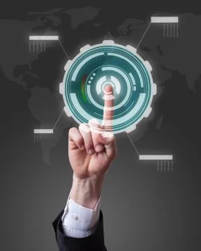 Hand pushing a button on a touch screen futuristic interface Stock Photos